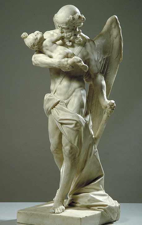 Statue en marbre blanc représentant un viel homme avec un enfant dans les bras. Il semble le manger.