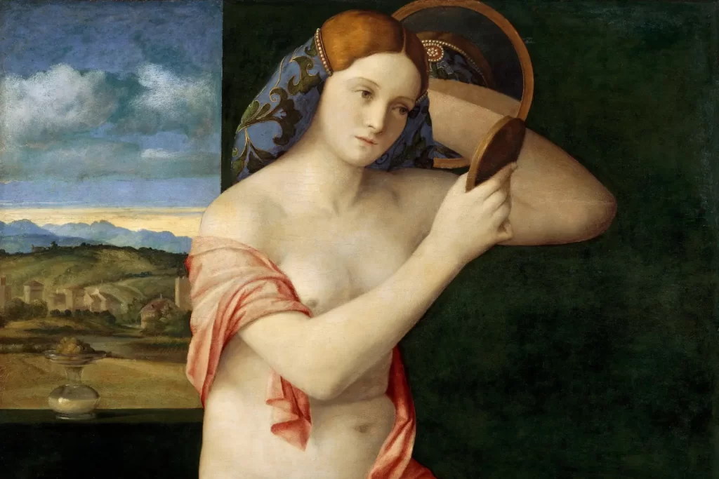 Jeune femme nue observant son reflet dans un miroir, tableau de Giovanni Bellini illustrant l’introspection et la connaissance de soi.